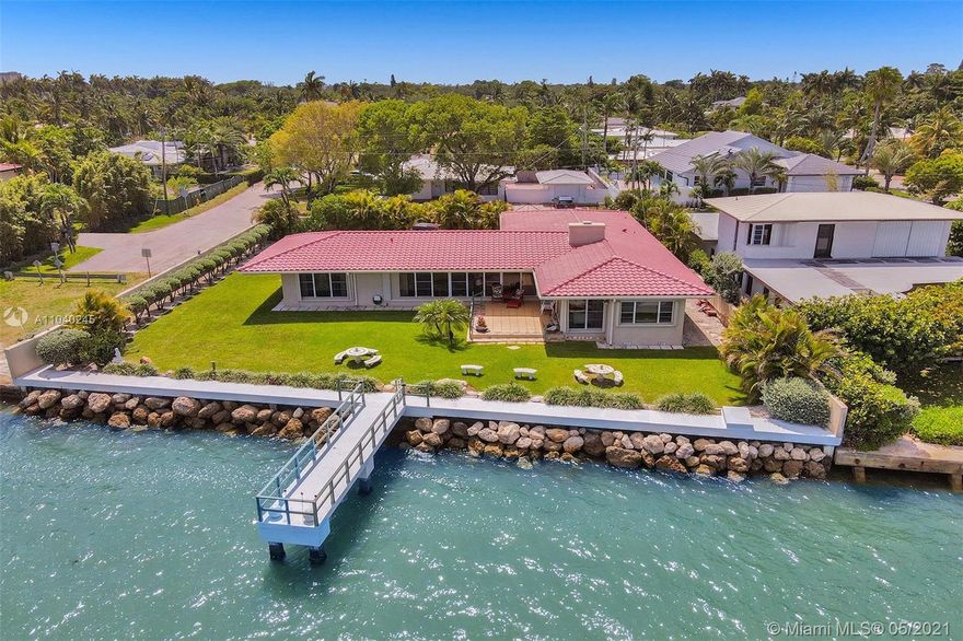 Rarely available BAYFRONT 2/2 home with gorgeous sunrise exposure. Live in luxury in Miami’s coveted Upper East Side & the MIMO District. Look across Biscayne Bay with unobstructed panoramic views of North & South Beach skylines from your beautifully landscaped and secluded home (105' frontage). Kitchen, dining, living & family rooms flow perfectly for marvelous entertaining with family & friends. This wonderful 1952 Miami waterfront residence is ready for immediate living, renovation or new modern construction. Stunning water views from all rooms. New seawall cap, new roof, new AC, new appliances. House generator, over-sized dock, 2car garage. A few blocks drive to MIMO District’s fine restaurants, art galleries, & shopping, or boat to dinner at restaurants on Normandy & Treasure Islands.