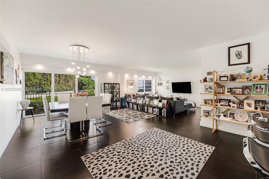Bayfront condo with wide bay views! Impact windows throughout. Porcelain floors, 2 A/C units and 2 tankless water heaters, Toto fixtures, and a renovated open kitchen.  Tastefully updated, with very large bedrooms and baths on a split floor plan. Large walk-in closets, washer/drier in the unit. 2 large storage units, and 2  assigned parking spaces. Bayfront pool with occasional dolphins and other sea creatures swimming along the bay.  Classic MIMO building located in a quiet Miami Shores street.  Very easy to show!
