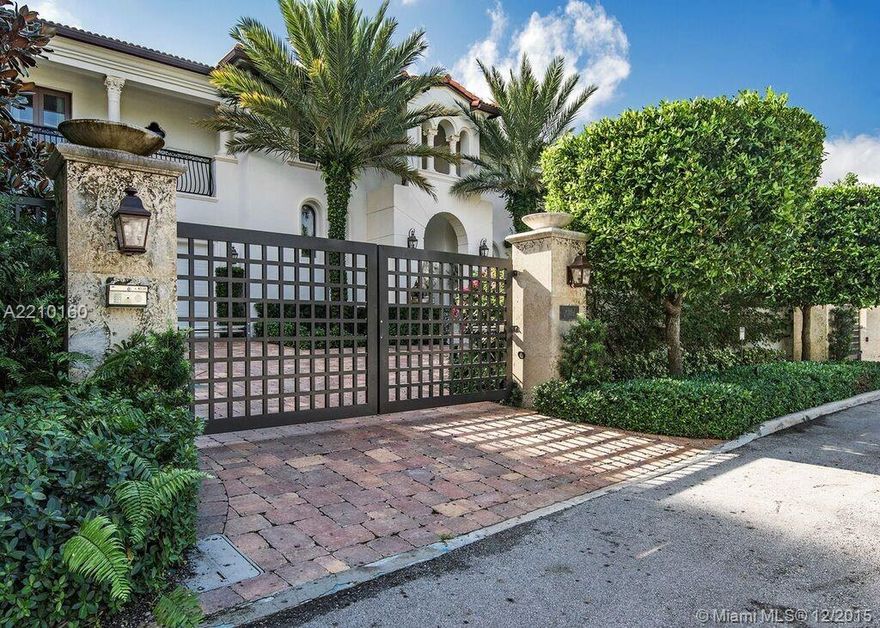 VILLA MAGNOLIA - Rare opportunity for this Bay Harbor Islands waterfront estate w/unobstructed views of wide bay & Indian Creek golf course. Mature landscaping & exterior lighting, expansive back garden for entertaining & 75' heated lap pool. Large dock w /24,000 lb boat lift on deep water w/direct ocean access. Enter through private gates, impact glass throughout, perimeter cameras, alarm system & generator. 7,100 sq. ft under air, incl. guest cottage, 800+ bottle wine cellar, media room & library.