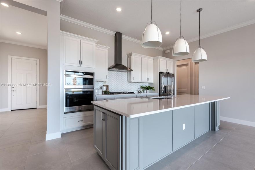 BRAND NEW Highly desirable Ashby model in Veranda Gardens! LOADED w. upgrades! PREMIUM Oversized Corner Lot. This beautiful home has 4 beds, 2.5 bath, 3 car garage, an open-concept floor plan, large Built-In kitchen, Whirlpool stainless steel appliances, 36" cabinets & quartz countertop, cabinet wrap island, & natural gas stove. 12' High ceiling w. 8' interior doors. Hurricane impact windows throughout with Pocket sliding doors in the Living room area. All bathrooms have upgraded cabinets, sinks, shower wall tile to the ceiling, frameless shower doors, Owner's suite w. a TUB. Veranda Gardens has state of the art clubhouse: indoor/outdoor gym, community pool, lap pool, jacuzzi, fire pit, tennis/basketball courts, kids' playground, dog park! Minute to Turnpike and Publix shopping plaza.