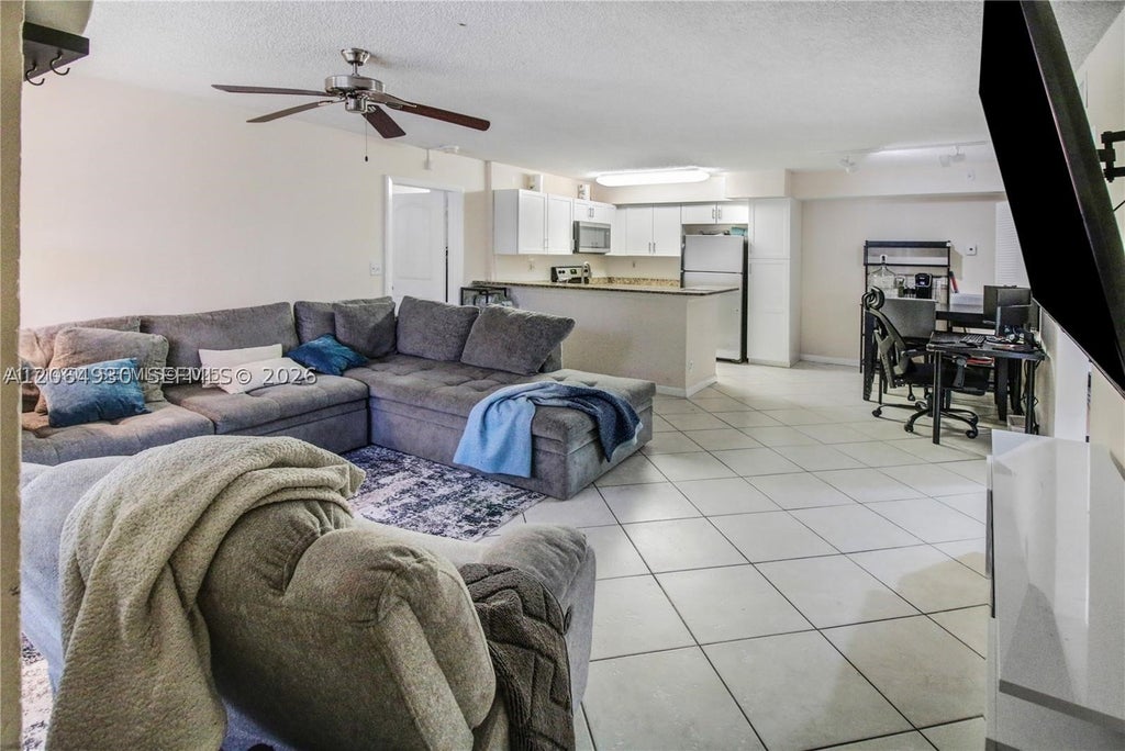 Photo of 831 Lyons Rd #23101, Coconut Creek, FL 33063 (MLS # A12064930)