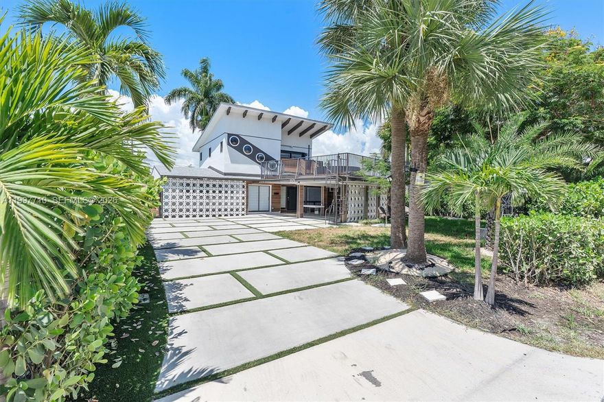 Classic restored Mid Century wonder with modern conveniences located near the finest shopping, and schools at a highly discounted price! SELLER IS SELLING IT $115,000 BELOW BPO FOR A QUICK SALE. $850,000 BPO WITH RECENT COMPS. Located in the desirable Coral Woods neighborhood, this large 3-bedroom, 3-bath home blends comfort and style with thoughtful updates throughout. The kitchen and bathrooms have been tastefully refreshed, offering a modern touch. Enjoy a low-maintenance turf yard, balcony, and an extremely rare and large sized deck perfect for relaxing or entertaining. The driveway provides ample parking, and impact-resistant windows and doors add peace of mind. The home offers an open floor plan with plenty of areas for both gathering and entertaining.The bright modern kitchen with a large island, stainless steel appliances, custom cabinets, quartz countertops and an abundance of natural light.  It's just 1.5 miles from Fort Lauderdale Beach, this home is also close to local supermarkets, shopping, and dining. Whether hosting friends or enjoying quiet moments at home, this property offers a wonderful balance of convenience and charm. SERIOUS QUALIFIED BUYERS ONLY.