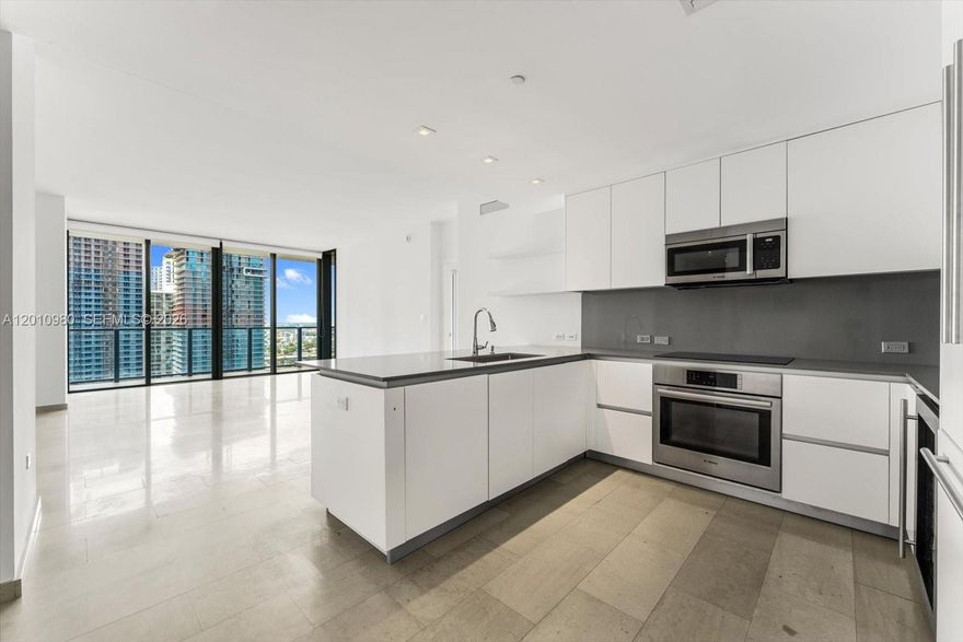 Nestled in the sought-after Reach at the Brickell City Center,designed by Arquitectonica, this contemporary unit features 3 bedrooms plus den, 3 full and 1 half bath. Showcasing 1, 660 Sq. Ft. of bright living spaces with an open floor plan, the kitchen has modern Italian cabinetry. The main suite has a spa-like bath and beautiful views from a spacious balcony which is accessible from every room. Italian custom made closets in every bedroom. Stellar amenities include a half-acre amenity deck featuring tropical gardens, BBQ grills, state-of-the-art fitness center, a children's play area, heated lap and social pools, a library, business center and a full-service spa with hammam. Step directly into Brickell City Center and enjoy the convenience and luxury of having an adjacent sophisticated shopping mall and dining. Discover a lifestyle blending sophistication with city allure.