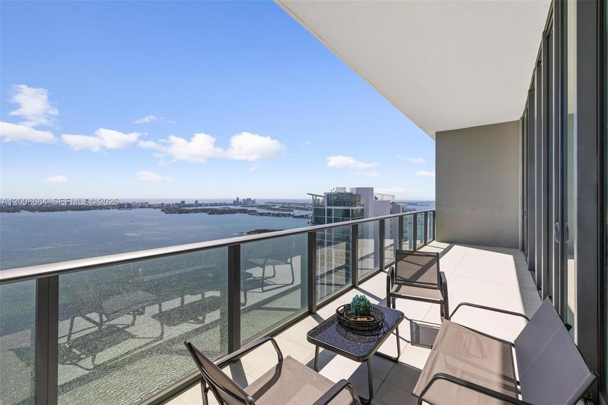 Beautiful Edgewater penthouse with incredible Biscayne Bay views from every angle. This 4 bed, 4.5 bath home, including 2 primary suites facing the bay, features high ceilings, a private foyer, designer finishes, and a large balcony with a jacuzzi.
A special highlight: both primary suites offer wide, open water views that make each room bright and peaceful. The chef’s kitchen includes top quality appliances and plenty of space.
This is a rare opportunity with 4 parking spaces and a big storage room on the same floor. Enjoy top amenities such as Miami’s largest round pool, a modern gym, spa, bowling alley, and more. Located in the Paraiso District, just steps from great restaurants, shops, and the new Whole Foods.
A stunning home in the sky with views you will love every day.