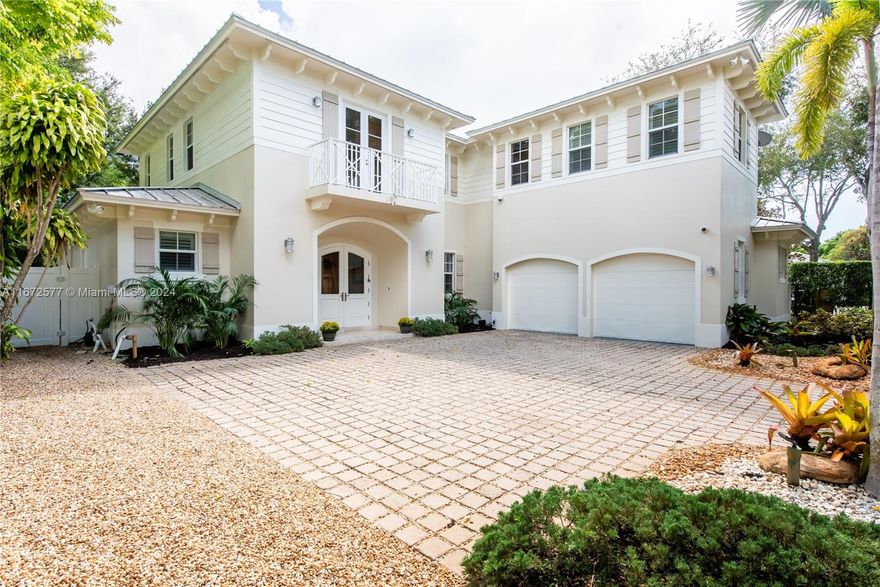 Welcome to this coastal-vibed Key West-style residence, a five-minute walk to shops & dining in downtown South Miami. Plentiful natural light and an open floor plan are key features of the house, set on a tropically-manicured, private lot with a gorgeous mature oak tree in the backyard. The kitchen features top-of-the-line appliances and a spacious island, seamlessly connecting to bright living & dining areas. Walk-in refrigerated wine cellar & pantry off kitchen. The upstairs master suite includes a grand ensuite bath and oversize walk-in closet. Two bedrooms downstairs, including a cabana bath. Step outside to a gorgeous 300+ Sq. Ft. covered patio with built-in BBQ grille and an outdoor TV.  Jump into a refreshing pool, with plenty of space for gardening & play. Full-house generator!