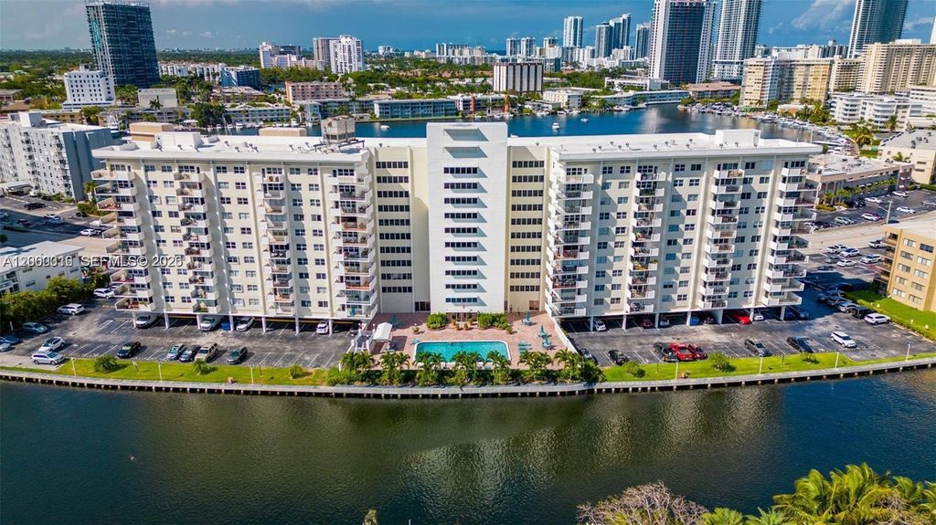 Photo of 401 Golden Isles Dr #801, Hallandale Beach, FL 33009 (MLS # A12000316)