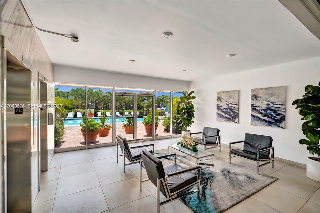 Photo of 401 Golden Isles Dr #801, Hallandale Beach, FL 33009 (MLS # A12000316)