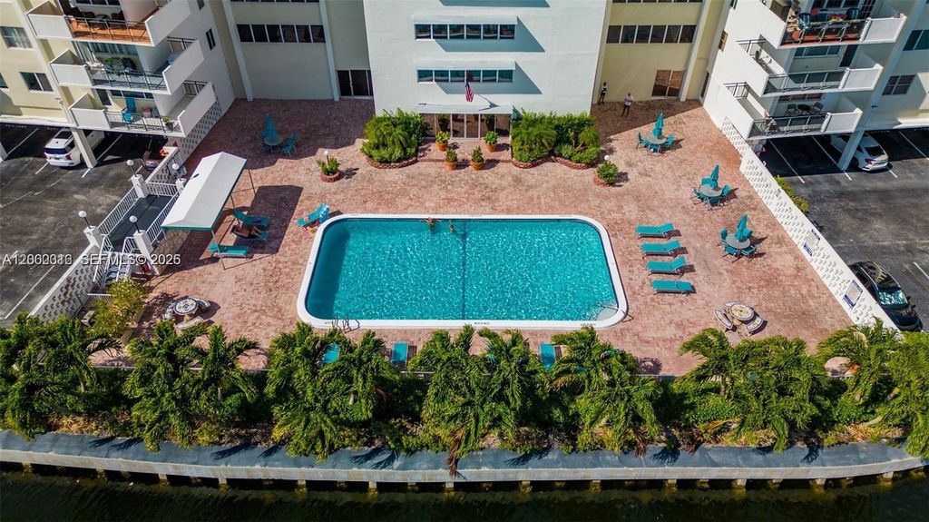 Photo of 401 Golden Isles Dr #801, Hallandale Beach, FL 33009 (MLS # A12000316)
