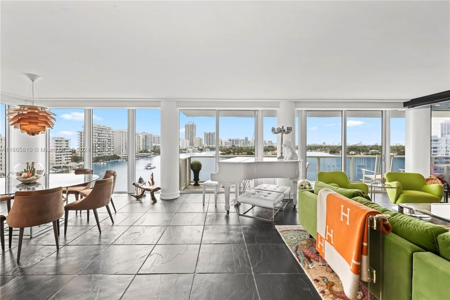 An entertainer & boater’s paradise! This rare corner 4-bed, 3-bath condo encompasses stunning views of the Ocean, Intracoastal, and Bay! Overlooking La Gorce &  Allison Island, blending sophistication & elegance.. The inviting foyer opens to a custom kitchen with a spacious island and ample storage. Enjoy two balconies, including one that spans nearly 90 feet, ideal for soaking in breathtaking sunsets. The primary suite is a serene retreat with custom closets and direct water views. This luxurious home features heated floors, motorized shades, and a Kangen water system. Exceptional amenities include a 24/7 doorman, valet, an Olympic-sized heated pool, a gym, and a marina with a dock slip for boats up to 75 feet. An extraordinary lifestyle awaits in this unparalleled haven!