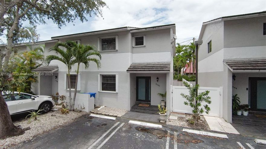 Rare to find a Gem like this 3 bedroom 3 full  bath townhome steps away from Coral Gables.  Small quiet Community of only 8 townhouses tucked away in the beautiful residential area of Alhambra Gate.  This well kept home has a bedroom and full bath on the first floor.  Ceramic floors downstairs and well kept deep-pile carpet in bedrooms.  Bathrooms were remodeled a few years ago,  Spacious Walk-in Closets, En-Suite Bathrooms upstairs.   Nice private balcony in master bedroom.  Peaceful tiled Garden patio to relax. Impact Doors and Accordion Shutters in all Windows.  A 5 minute Walk to Miracle Mile,  renowned restaurants and shops of Coral Gables.