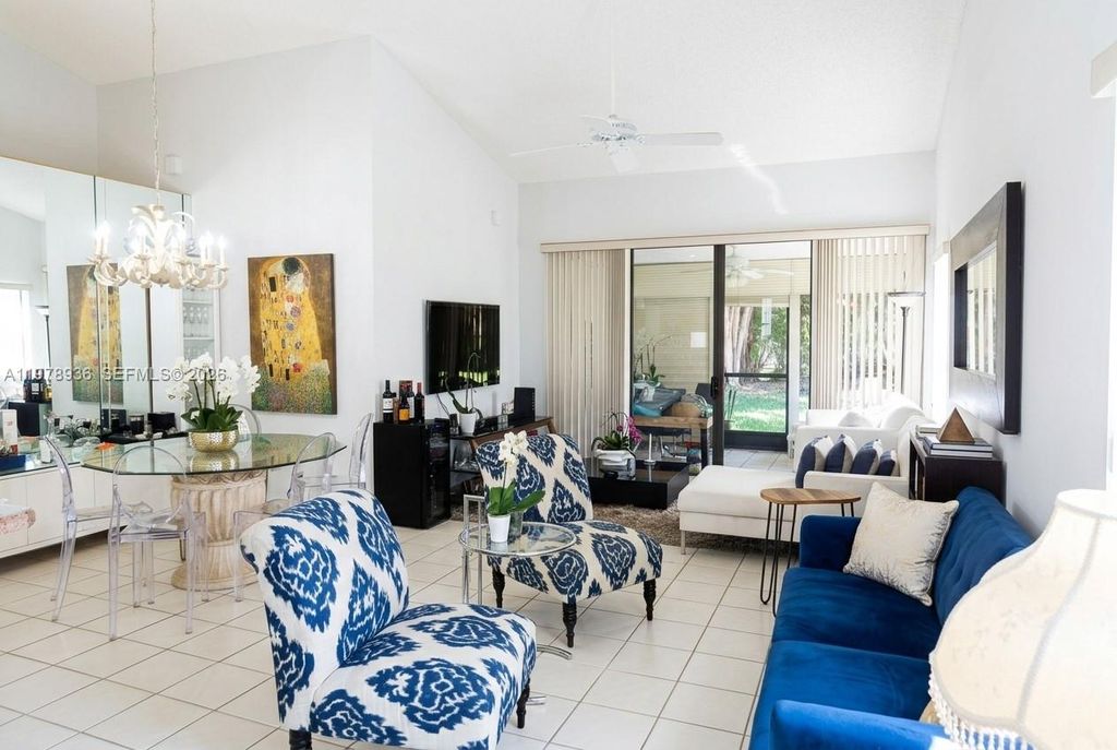 Photo of 7604 Lexington Club Blvd #B, Delray Beach, FL 33446 (MLS # A11978936)