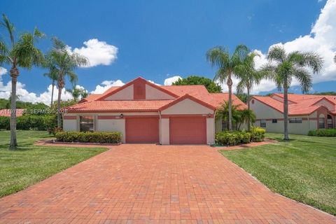 Photo of 7604 Lexington Club Blvd #B, Delray Beach, FL 33446 (MLS # A11978936)