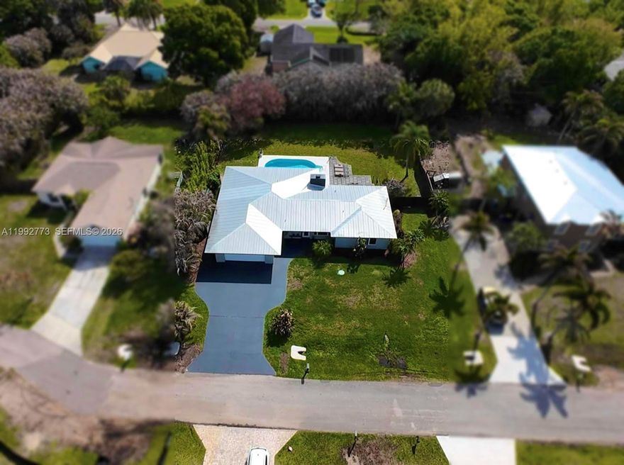 Fully reimagined and impeccably renovated, this 4-bedroom, 2-bath pool home offers 2,098 square feet of sophisticated living on an expansive 0.32-acre lot in sought out Beau Rivage neighborhood. Every detail has been thoughtfully curated, blending timeless design with modern performance. Featuring a brand-new A/C system, full impact windows, metal roof, and spray foam insulation for maximum efficiency and durability. The spacious open layout is ideal for both everyday living and entertaining, with abundant natural light and a seamless flow between living areas. The newly configured 4-bedroom floor plan provides flexibility for families, guests, or a home office setup. Situated on a quiet street and the HOA is voluntary! Ideally located just minutes from downtown Stuart, pristine beaches, and premier dining and shopping, this residence represents a rare opportunity to own a turnkey home where quality, design, and location converge.