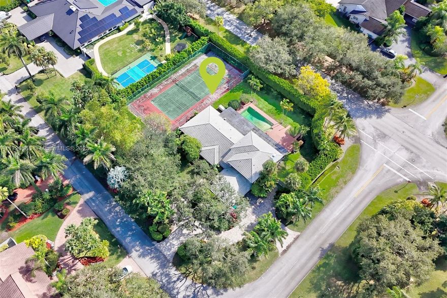 Paradise awaits you in the Galloway Glen neighborhood. Sitting high above ground and nestled on a 34,848 SF oversized corner lot surrounded by beautifully maintained landscaping. Spacious 5 bedroom, 4.bathroom home with close to 5000 interior square feet includes a 2-car spacious garage, pool, tennis courts and entertainment area. Soaring ceilings, natural light, marble flooring throughout the living areas and carpet in bedrooms. Large family room with a mini bar that opens to the covered terrace along the back of the house. Impact windows and doors throughout as well as electric shutters for additional convenience and privacy. Updated roof and new AC upstairs. Part of the Baptist Hospital Grid, and has a new Generator with two underground tanks.  24 hour neighborhood police surveillance.