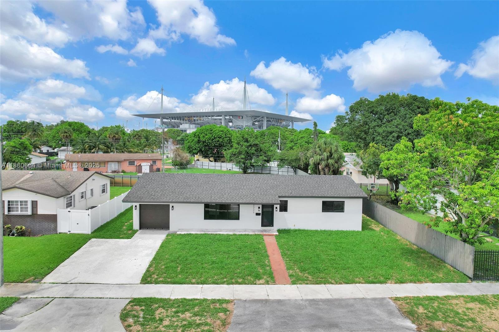 Step into this fully renovated 3 bedroom 2 bathroom home with a garage, ideally located just minutes from Hard Rock Stadium. Featuring a modern open layout, updated kitchen with a beautiful dine in island, stylish bathrooms, and fresh finishes throughout, this move-in ready home offers both comfort and convenience. Enjoy a spacious backyard perfect for entertaining or relaxing, plus easy access to major highways & entertainment