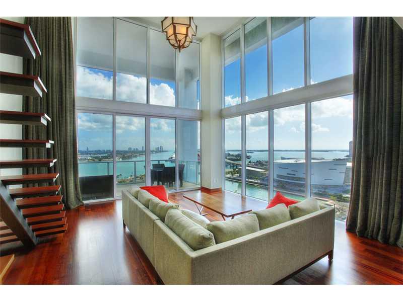 SPECTACULAR 2 STORY EAST VIEW LOFT AT TEN MUSEUM PARK. FEATURES INCLUDE 20 FT CEILINGS GORGEOUS DARK BRAZILIAN CHERRY HARDWOOD FLOORS THROUGHOUT. STATE OF THE ART KITCHEN WITH SUB ZERO, MIELE & BOSH APPLIANCES. BLACK GRANITE KITCHEN ,MOTARIZED WINDOW TREA TMENT IN LIVING ROOM , GLASS UPSTAIRS RAILING , FABULOUS LIGHT FIXTURES IN DINING & LIVING ROOM.