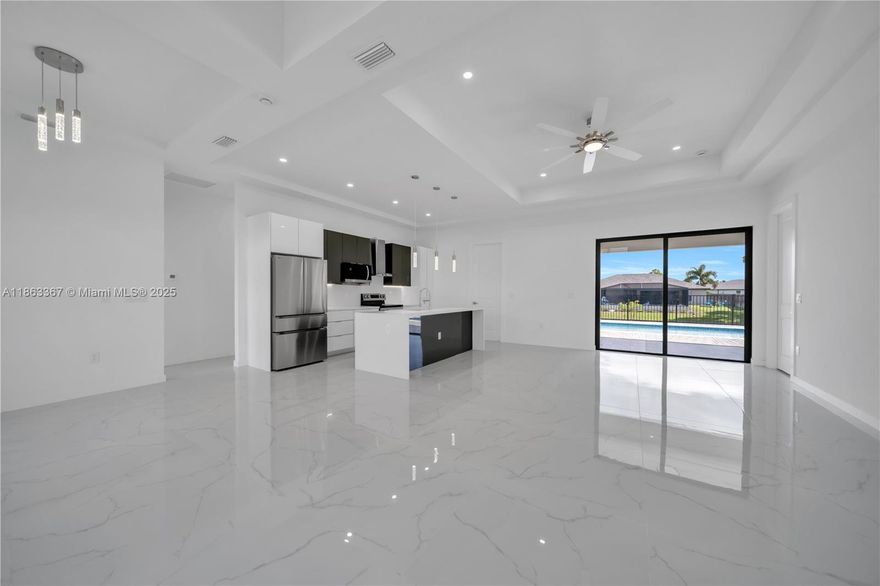 STUNNING MODERN NEW CONSTRUCTION! This move-in ready home features 3 bedrooms plus a DEN, 3 FULL baths (including one with direct pool/lanai access), and a bright open-concept layout. Enjoy a modern kitchen with STAINLESS STEEL appliances, QUARTZ countertops, pantry closet, and pendant/recessed lighting. Relax or entertain in the generously sized lanai with OUTDOOR SINK, overlooking the FENCED POOL, backyard oasis, and peaceful canal views. The primary suite boasts 2 WALK-IN CLOSETS, a spacious shower and dual sinks. IMPACT DOORS & WINDOWS, and a 2-car garage with EPOXY FLOOR add to the appeal. With 2341sq ft under roof, this exceptional property is ready for you —schedule your tour today!