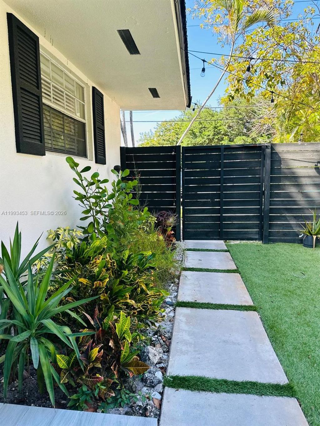 Photo of 1002 NE 119th St #F, Biscayne Park, FL 33161 (MLS # A11993453)