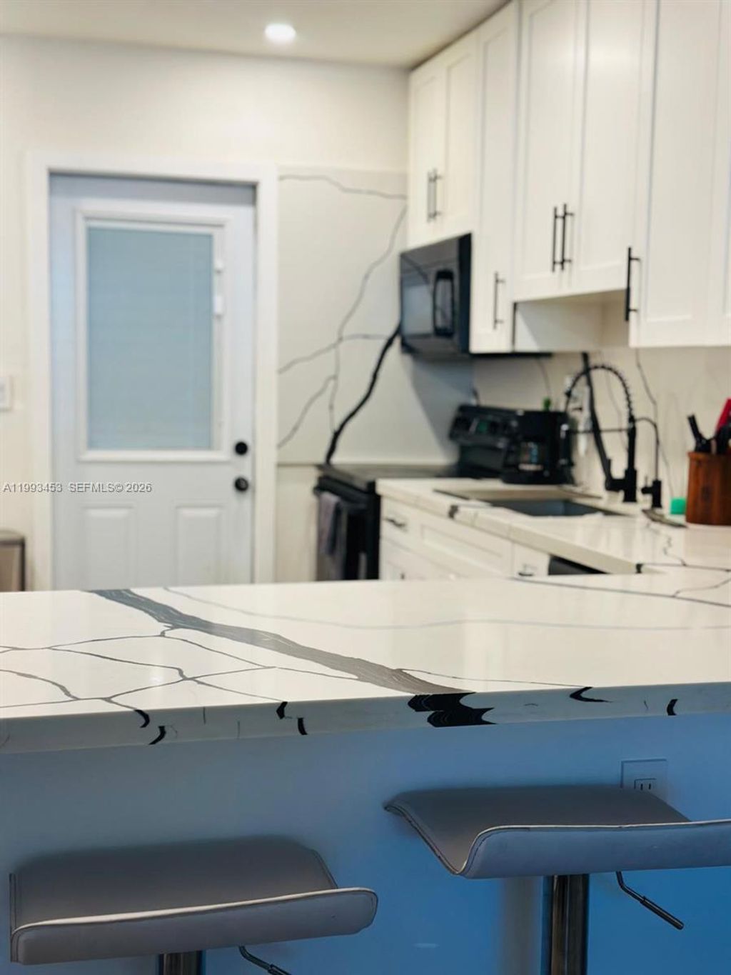 Photo of 1002 NE 119th St #F, Biscayne Park, FL 33161 (MLS # A11993453)