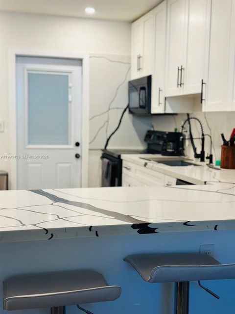 Photo of 1002 NE 119th St #F, Biscayne Park, FL 33161 (MLS # A11993453)