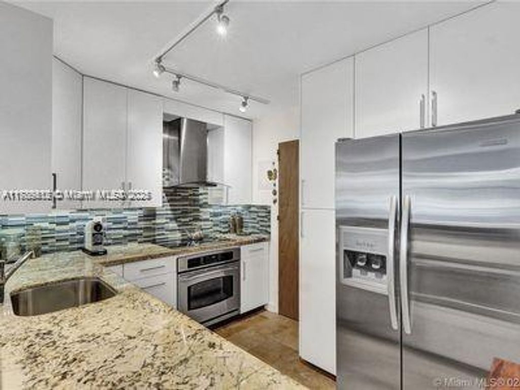 Photo of 401 Golden Isles Dr #201, Hallandale Beach, FL 33009 (MLS # A11785512)