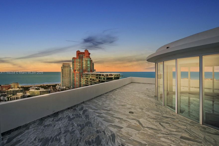 Completely renovated two-story Penthouse, Italian "Statuario Venato" Marble throughout the whole unit. Master bedroom overlooking a one of a kind, rare Roof Top totaling 1073sqf (99 m2). Custom Italian Kitchen, Miele appliances, Miele built-in coffee maker, Miele built-in wine cooler with a capacity of 102 bottles to store, Sub Zero refrigerator. Bathroom Vanities from Antoniolupi.  Luxury living in the hearth of the most exclusive neighborhood of South Beach with endless amenities: 2 pools, 2 tennis courts, state of the art Gym and Spa, private Beach Club.