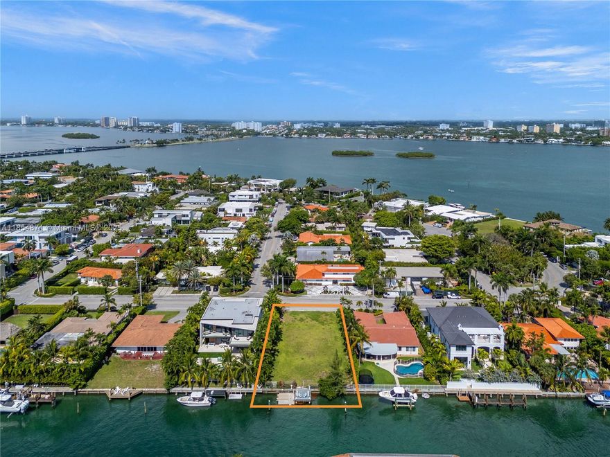 Build the Dream in Bay Harbor Islands! A rare opportunity to own a vacant 11,250 SF lot in one of Miami’s most coveted neighborhoods. With endless potential, 75' of water frontage & existing dock, this is your blank canvas to design and build the custom home you’ve always envisioned—tailored to your taste, lifestyle, and every desire. No fixed bridges to bay! Located in exclusive Bay Harbor Islands, enjoy quiet, tree-lined streets just minutes from top-rated schools, pristine beaches, Bal Harbour Shops, fine dining, Houses of Worship, and parks. A prime location for those seeking luxury, convenience, and community in one. (Set of complete plans to build a new house are ready for submittal).
