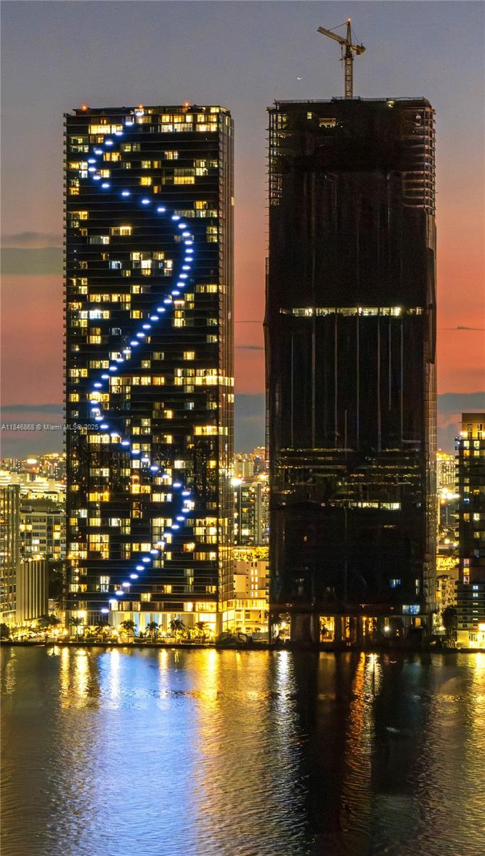A new era of indulgence in this panoramic 1978 sqft, 3-bed retreat with 3.5 bath with a versatile den that converts to a guest suite or office at iconic Aria Reserve. Best-in Miami - direct, unobstructed ocean views over Biscayne Bay through floor-to-ceiling impact glass and terrace. Refined finishes and top-tier appliances create effortless luxury. Elevate daily life with 2 acres of exclusive world-class amenities: 3 pools, sauna, steam and massage rooms, game room, gym, children's room, conference center, putting green, tennis/basketball/pickleball courts. Walk the waterfront to the opera, ballet, theater, museums, concerts, and games. Minutes from: Wynwood (2), Midtown (3), Design District (4), Downtown & Brickell (5), Miami Beach (6). Walk to Whole Foods or 2 min to Trader Joe’s.