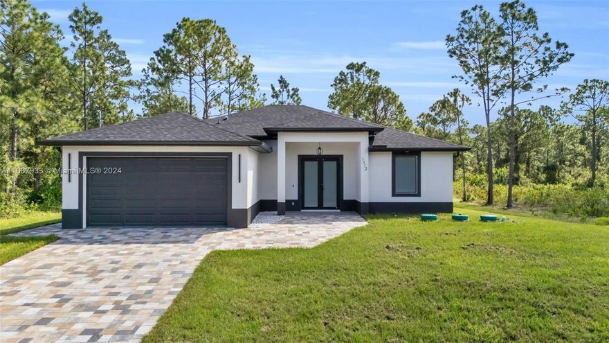 Discover modern elegance and tranquil living on a half-acre lot at the end of a quiet dead-end street! This stunning 3-bedroom, 2-bathroom home provides the privacy and space you've been searching for. Perfect for those with a boat, RV, or plans for a pool, this home offers ample room for family gatherings. Inside, the open floor plan is highlighted by a sleek kitchen featuring white cabinetry, quartz countertops, and modern silver fixtures. Spa-like bathrooms boast LED mirrors with dimming and anti-fog technology. The master suite includes dual shower heads, while custom closets add personalized storage in every room. Relax on the screened lanai or enjoy the nearby conveniences of shopping, schools, and medical facilities. Schedule your showing today!