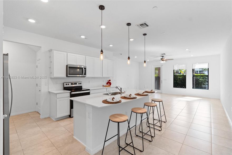 Your new home awaits at Emory Townhomes! Located in a gated community at Midtown Square in Plantation, near beautiful Central Park. This modern residence offers a smart, open layout with impact windows and doors, a spacious owner’s suite with walk-in closet, and two additional bedrooms upstairs. The main level features a designer kitchen with pantry, snack bar, and gathering room opening to a private patio—perfect for relaxing or entertaining. Enjoy resort-style amenities including pool, pavilion, BBQ area, fire pit, and reliable AT&T Internet service. All windows have window treatments. A perfect blend of comfort, style, and location!