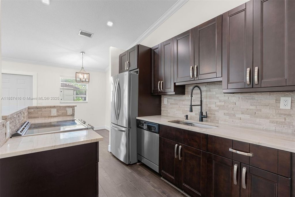 Photo of 721 NW 47th St, Deerfield Beach, FL 33064 (MLS # A11857416)