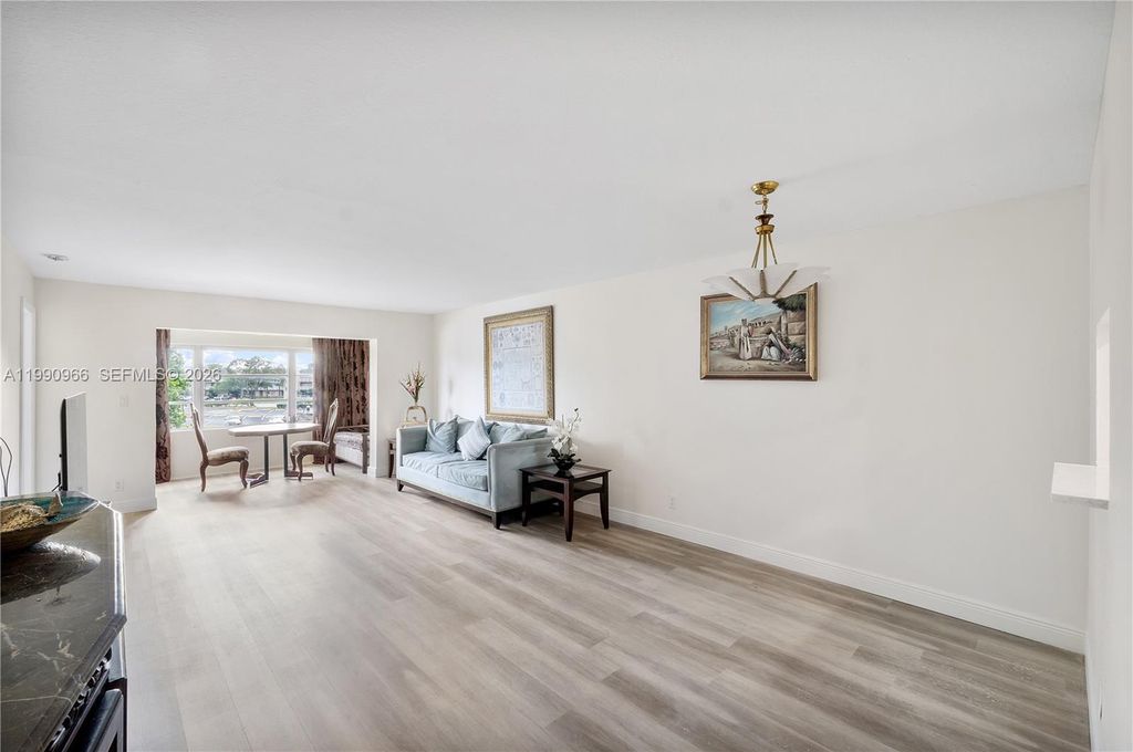 Photo of 9201 Sunrise Lakes Blvd #304, Sunrise, FL 33322 (MLS # A11990966)