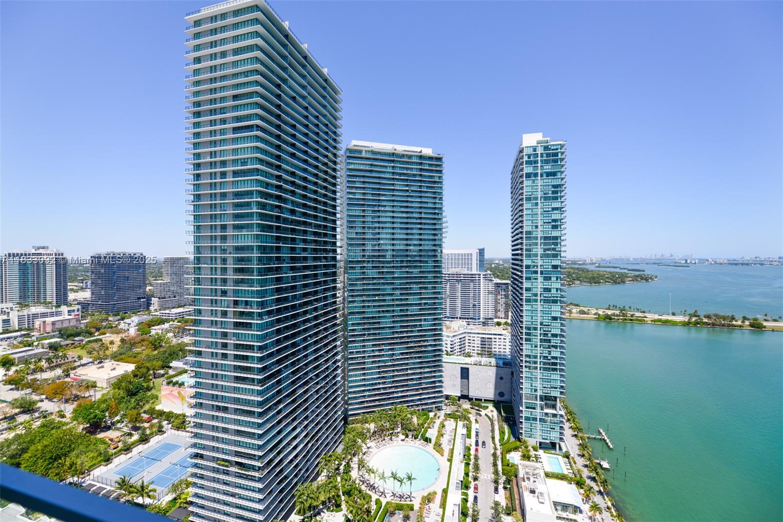 Amazing 4bed/4.5baths, corner unit with private elevator entry. Open layout, top-of-the-line finishes, Italian Ceramic & tile floors, custom closets, and endless direct bay and Miami Beach views. Electric shades and blackouts throughout the unit. Enjoy the ultimate lifestyle with gorgeous amenities, including a resort-style pool, residents lounge, wine-tasting room, full-service gym/spa, children's playroom, tennis court, bowling, and much more. Excellent Location! 15 from Miami Beach, 8 min from Wynwood, Midtown, and Design District, and 15 mins from Miami airport. Unit is ready to be occupied.