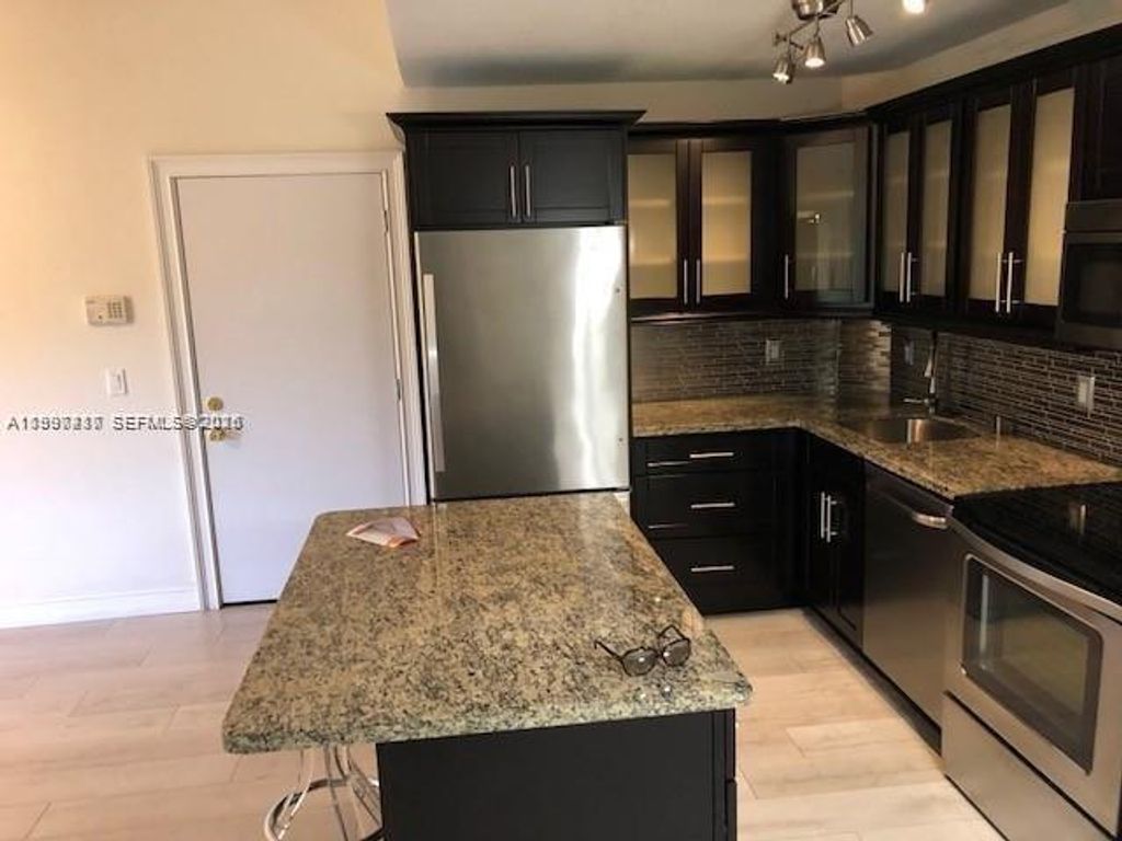 Photo of 10733 Cleary Blvd #304, Plantation, FL 33324 (MLS # A11997417)