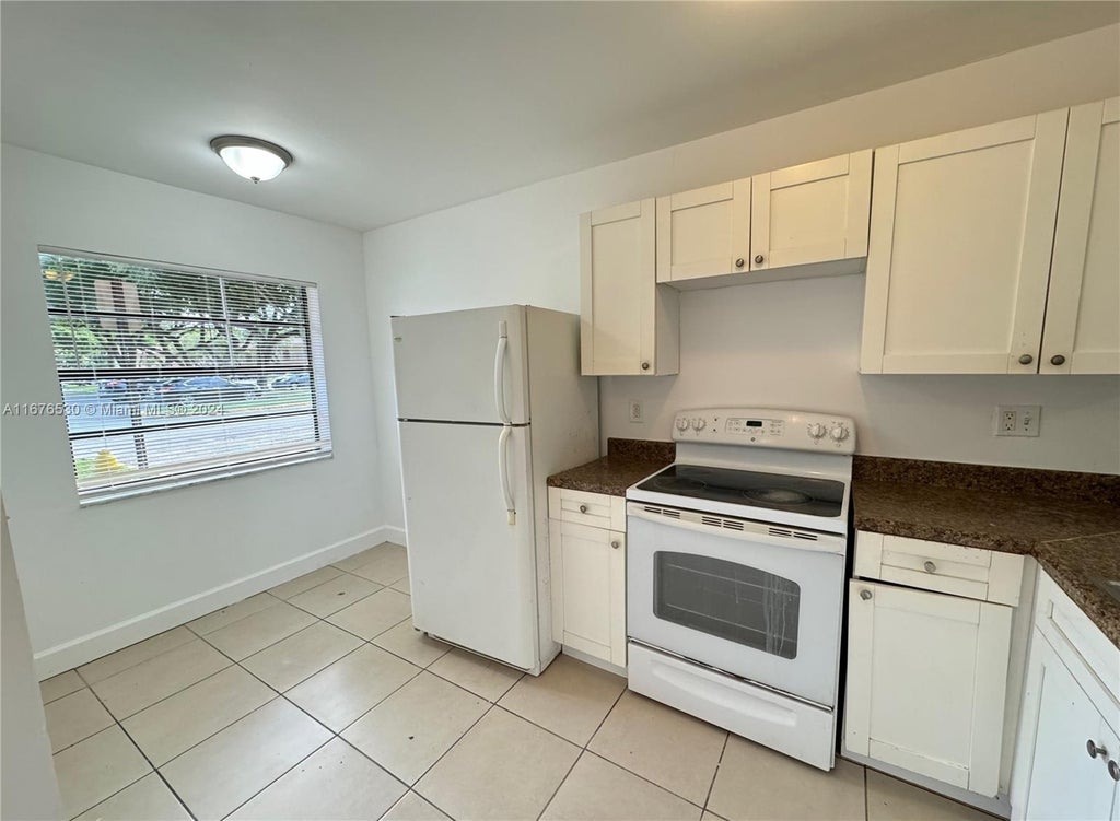 Photo of 4069 Lakeside Dr #4069, Tamarac, FL 33319 (MLS # A11676530)