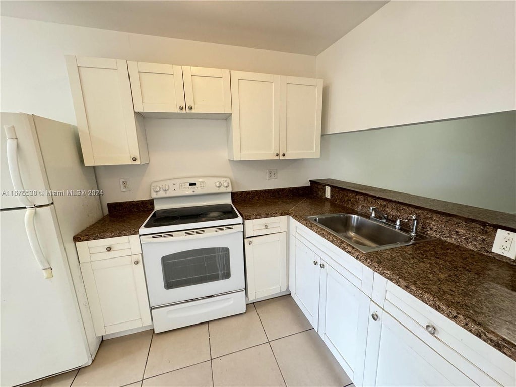 Photo of 4069 Lakeside Dr #4069, Tamarac, FL 33319 (MLS # A11676530)