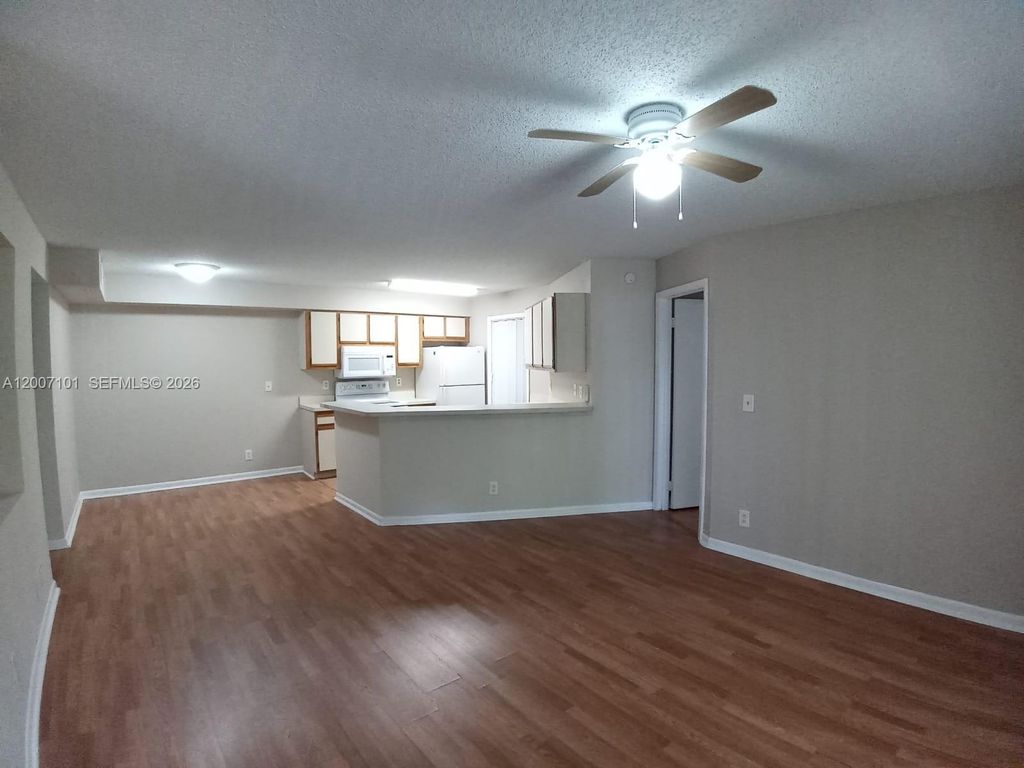 Photo of 9999 Summerbreeze Dr #504, Sunrise, FL 33322 (MLS # A12007101)