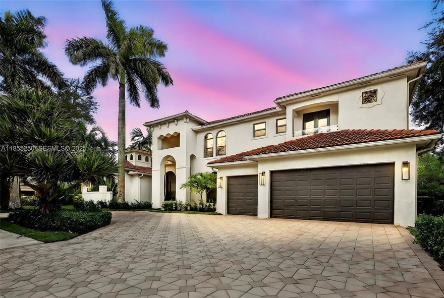 Stunning & fully remodeled home nestled in one of the most sought-after gated communities in Davie. Every detail was well thought out with impeccable taste. Over 5,000 sqft of living area featuring 5 beds, 6 full baths, an elegant glass door office & theater room. Get greeted by high ceilings & natural light. The floor to ceiling fireplace wall creates a striking focal point. Beautiful gray porcelain floors & wood-look tile upstairs. All new impact windows. New gourmet kitchen featuring a seamless design with Led lighting, porcelain countertops perfectly matching the custom wooden cabinets. Primary suite featuring an endless walk-in closet that leads to the flawless master bath. Modern Built-in wine display & custom bar perfect to entertain. Spacious backyard featuring a new summer kitchen