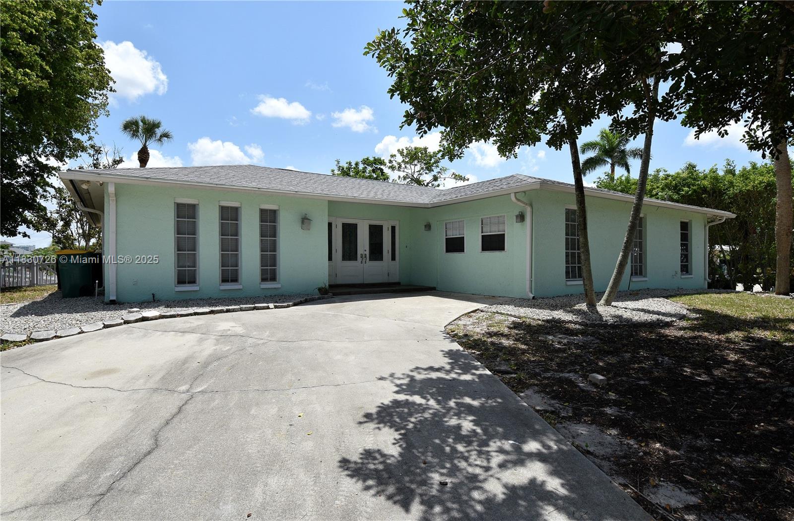 Waterfront Residence, located in the Bayshore Ats District. Close to restaurants, entertainment and shopping! This Home boasts plenty of space with 3 bedrooms and two bathrooms, over 2000 square feet of living area!. Inviting open concept kitchen featuring Stainless steel appliances, granite counters, beautiful kitchen island and lots of cabinet storage. The exterior offers a patio with separated paved pads surrounded with landscaping stone and a concrete dock with direct access to a navigable canal. Imagine enjoying your afternoons watching the sunsets! call me today to set your appointment!