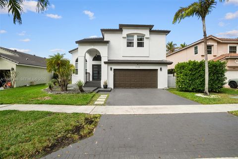 Photo of 1034 NW 184th Way, Pembroke Pines, FL 33029 (MLS # A11967146)