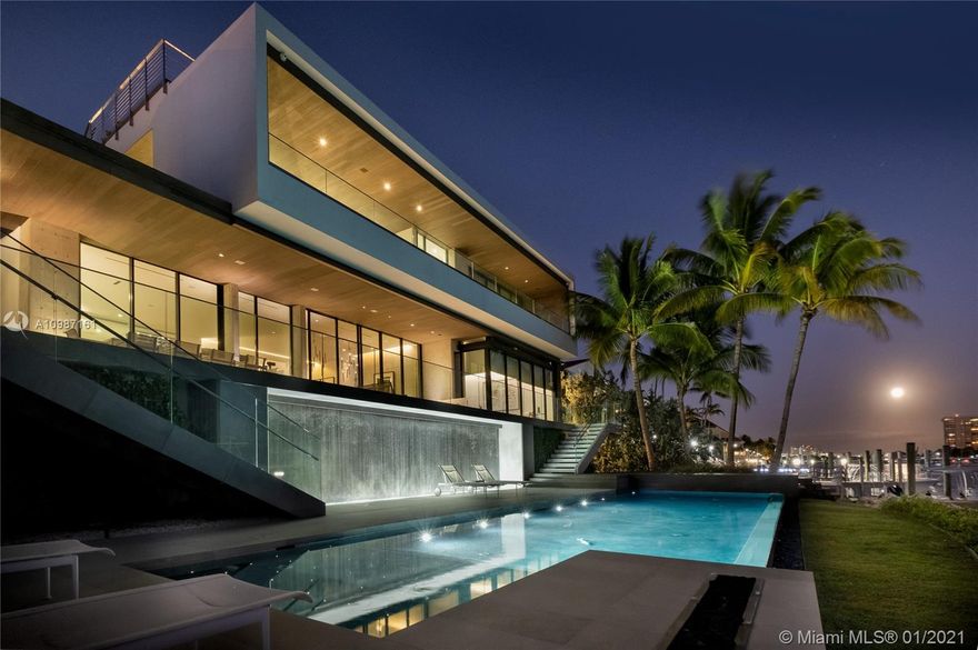 Spectacular Modern Max Strang masterpiece boasts open Bay Views & A1A 2017 Award of Excellence. Commanding 112 waterfront ft, the all-new concrete, steel & glass aerie unfolds over 9, 186 adj sf of curated Bayfront living. The ethereal home "floats" between land & sea on a prime point lot. Snap-tie concrete walls, frameless solid oak doors, pocket sliders, frameless glass rails; basalt & washed oak floors. Jaw-dropping living/dining gallery w/aquamarine views; Italian kitchen w/Wolf/Miele/Bofi appliances & adjacent family rm; stunning Master w/H&H closets, gym, office, uber-luxe bath; Jack & Jill suites; bonus bdrm; maid's rm; laundry; elevator. Rooftop deck; 41-ft dock w lift; saltwater infinity edge pool; dbl-high 2-car garage. A sensational Biscayne Bay estate, incomparable!