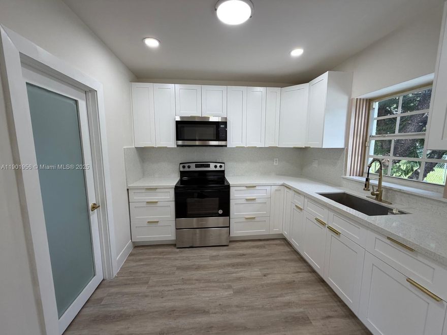 Beautifully remodeled 4-bedroom, 2-bath home featuring brand-new everything — from the kitchen and bathrooms to the flooring, roof, and A/C! Enjoy modern finishes throughout, an open layout perfect for family living, and an oversized yard ideal for entertaining or adding a pool. The expansive driveway offers plenty of parking for cars, boats, or RVs. Move-in ready and built for comfort — this is the perfect place to call home!