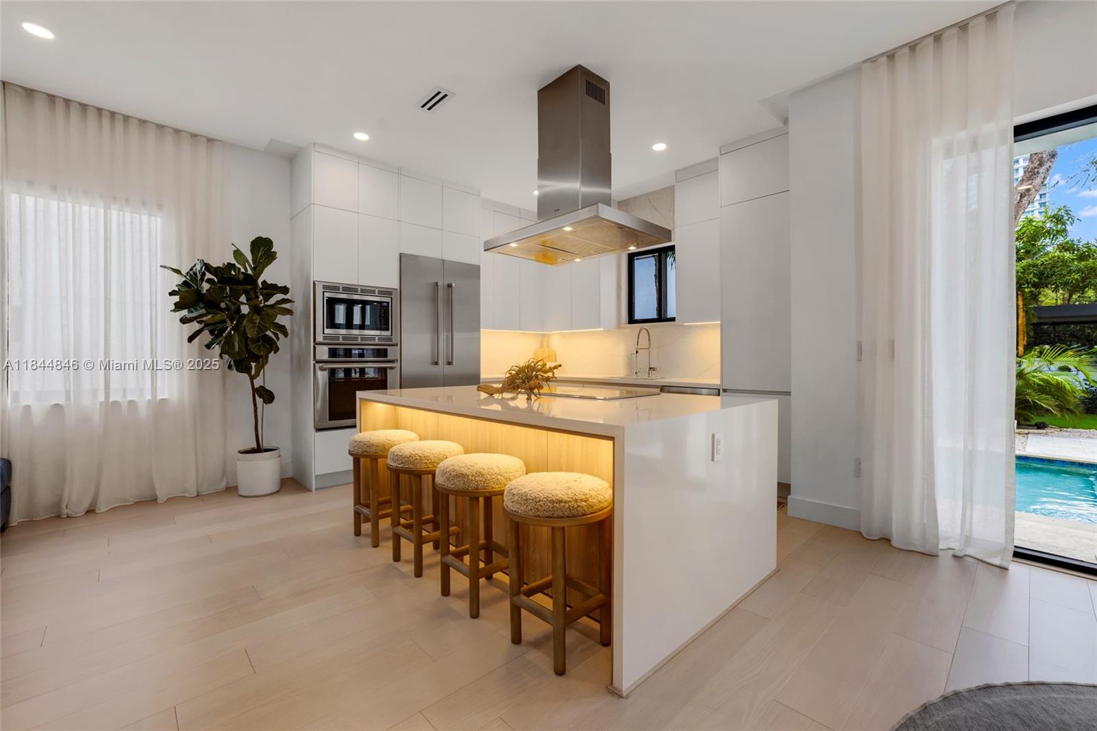 Your tropical escape in the heart of Coconut Grove! Located on a quiet cul-de-sac in highly sought-after North Grove, this fully furnished 3BD/3BA townhome offers elevated living with designer finishes throughout. Unlike many newer townhomes, it boasts true walkability to Regatta Park, CocoWalk and Miami’s best dining and shops. Top-rated schools. The light-filled layout features a chef’s kitchen with Thermador appliances and sleek Italian cabinetry. A dedicated office or study space adds flexibility. Outside, enjoy a private saltwater pool surrounded by lush greenery. Take the private elevator to your rooftop terrace with summer kitchen, lounge area, and optional cold plunge. Rare 2-car garage. Luxury, comfort, and location come together effortlessly in this Coconut Grove gem.