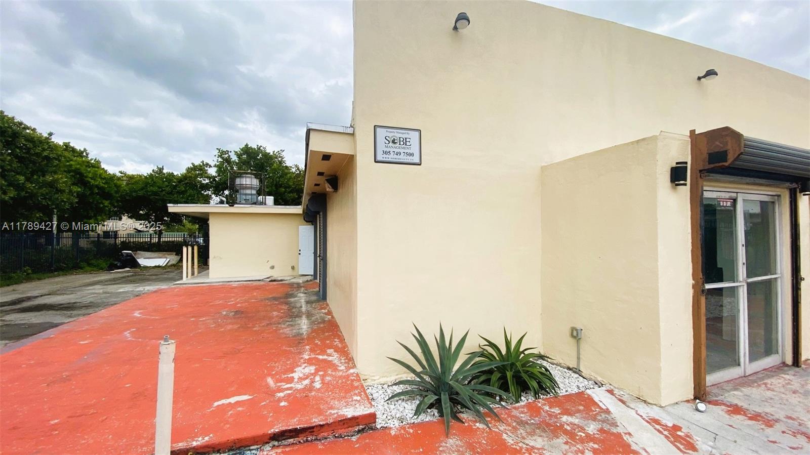 Free Standing Building Renovated and Recertified for 40/50yrs. Building is about 2,600 sqft. on a VERY BUSY NW 27 AVE & 79 ST. Property is completely fenced with two (2) gates main gate is electric. Updated Electrical & Plumbing. Exposed ceilings throughout warehouse. women & men bathrooms (handicap accessible). Kitchen and electrical room. Electric water heater. Many updates have been done to this property Signage pole still remain. Four (4) entry access with roll down metal shutters. Previously license was for entertainment/restaurant, but could easily be an office (medical/Law/etc..), warehouse, retail store, motorcycle shop, storage, etc.... No violation/ Clean Records completed 40 yrs recertification this property is ready to go for a new owner to start business.