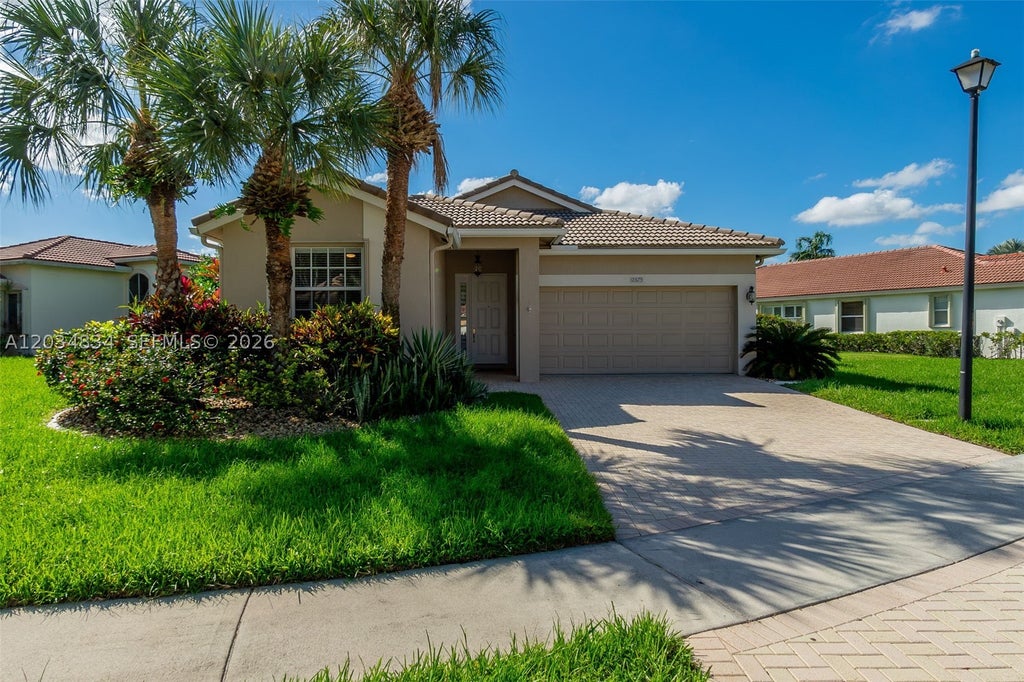Photo of 2675 Clipper Cir, West Palm Beach, FL 33411 (MLS # A12034834)