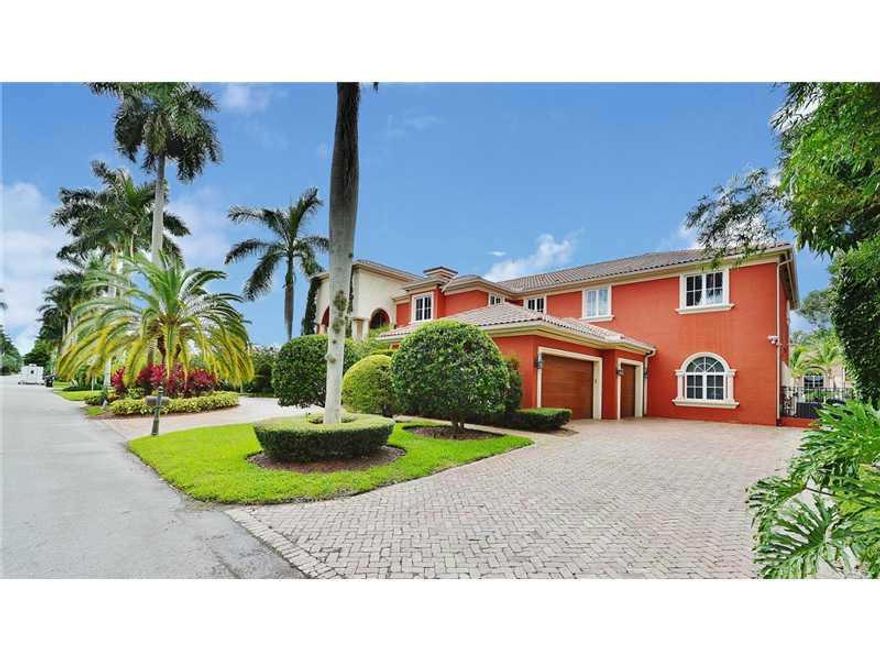 Las Olas home features a gourmet chef's kitchen, family room, bar, formal dining room, spa his and hers master bathrooms, master suite, oversized guest rooms, elevator. All custom woodwork and cabinetry, detailed iron work and stained glass windows. On th e best canal on Las Olas!