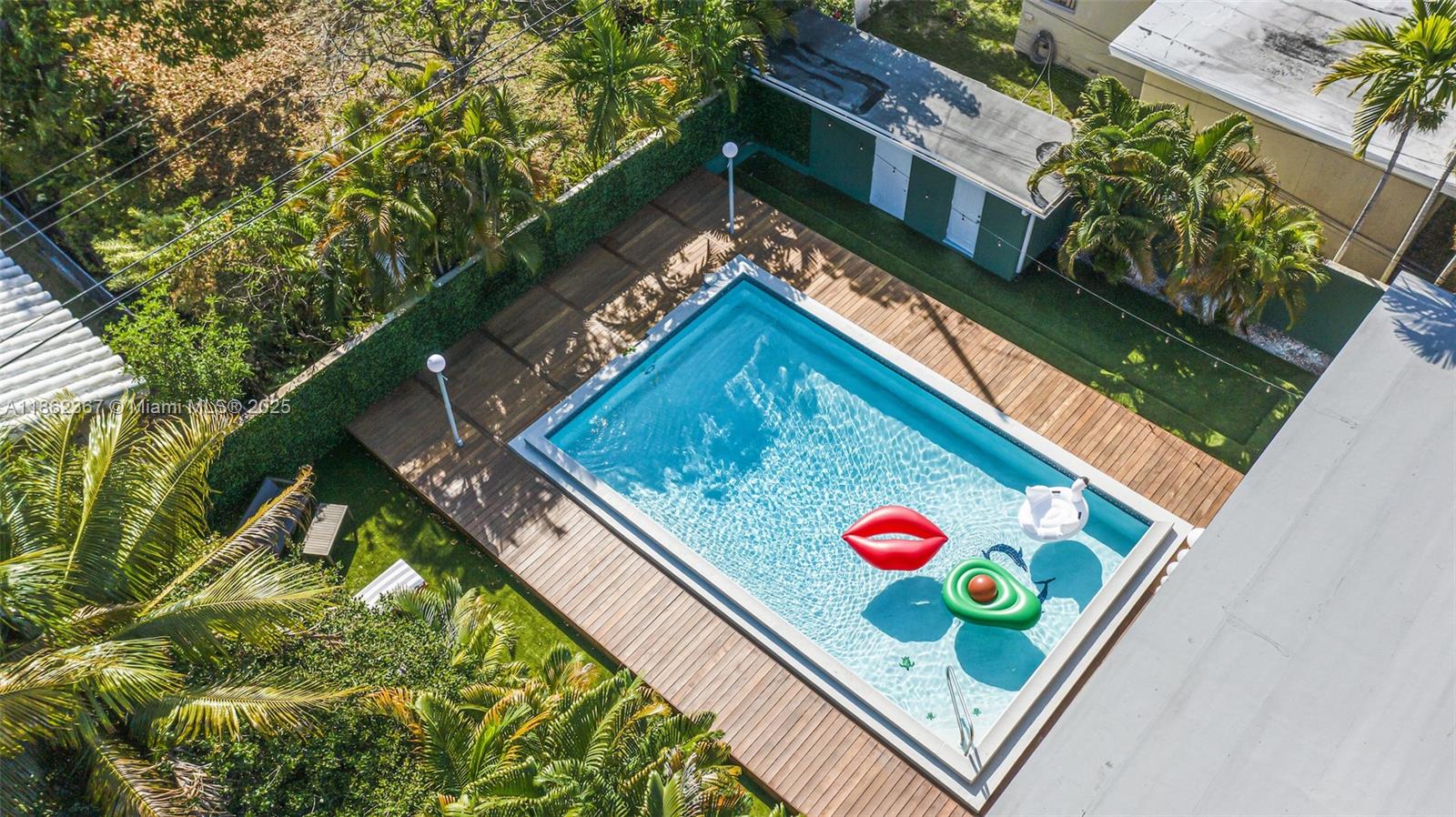 Welcome to Villa Armaza! Live bright and large in this spectacular, luxury pool home. Located in The Roads, an unbeatable Brickell location, enjoy the brand new remodel with high-end finishes. Sunbathe amongst the tropics by the lushly landscaped pool area and entertain with its fully equipped outdoor kitchen, covered porch, and open floor plan. The large foyer opens to the dining room, the ample kitchen and media room, which are warm and inviting, making this ideal for entertaining. The magnificent primary suite is a retreat, outfitted with a stunning walk in shower, freestanding tub, dual sink vanity, huge walk in closet, and views of the backyard. The three additional rooms are spacious, each with reach-in closets and excellent light. Large laundry room & parking for up to 4 cars.