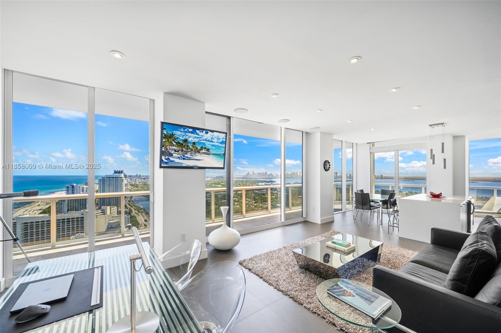 Completely remodeled penthouse residence in the prestigious Green Diamond. Originally a 2-bedroom, 2-bath, it has been converted to a spacious 1-bedroom to create an expansive living and dining area. The former second bedroom is now an open office space, adding versatility to the layout. Floor-to-ceiling windows fill the space with natural light and showcase incredible ocean, city, and bay views from every room. The primary suite offers a walk-in closet, a large soaking tub, and a separate shower. Enjoy the privacy of this corner residence along with the Diamond’s resort-style amenities.