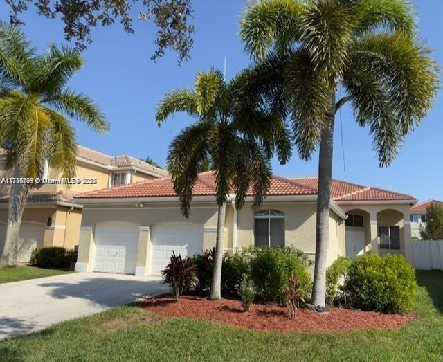 Fall in love with this updated 4 bedroom 2.5 bath home featuring travertine flooring throughout. 12' ceilings. private fenced yard, gated community. Private fenced yard in The Islands which is a gated community with 24 hour guard. This home features 12' ceilings in the main living area, solid wood cabinetry in kitchen and bathrooms, granite countertops in kitchen and bathrooms, stainless steel appliances. Recessed lighting throughout, tinted windows, extra attic insulation, 9' ceilings in most bedrooms except primary bedroom has 12' ceilings. Brand new roof completed in 2022. Lease option also considered.