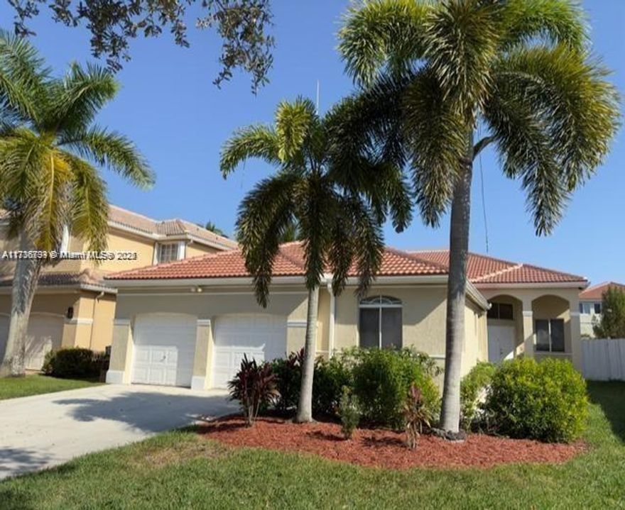 Fall in love with this updated 4 bedroom 2.5 bath home featuring travertine flooring throughout. 12' ceilings. private fenced yard, gated community. Private fenced yard in The Islands which is a gated community with 24 hour guard. This home features 12' ceilings in the main living area, solid wood cabinetry in kitchen and bathrooms, granite countertops in kitchen and bathrooms, stainless steel appliances. Recessed lighting throughout, tinted windows, extra attic insulation, 9' ceilings in most bedrooms except primary bedroom has 12' ceilings.  Brand new roof completed in 2022. Lease option also considered.